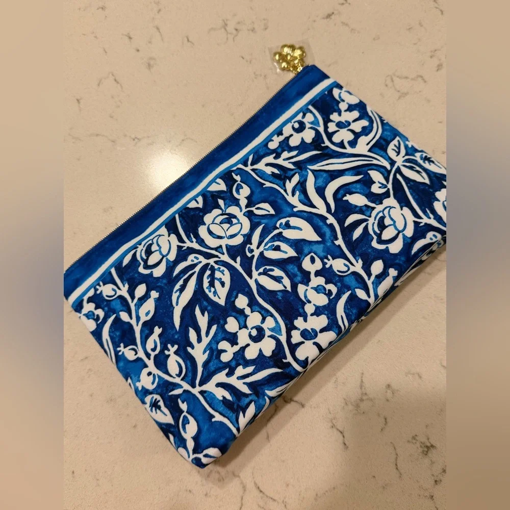 Blue and White Floral Pouch (Estee Lauder) with brand new sealed ulta products
